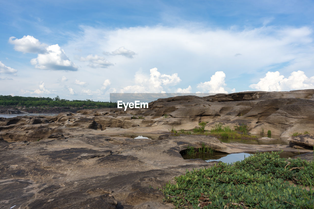 SCENIC VIEW OF ROCKS AGAINST SKY