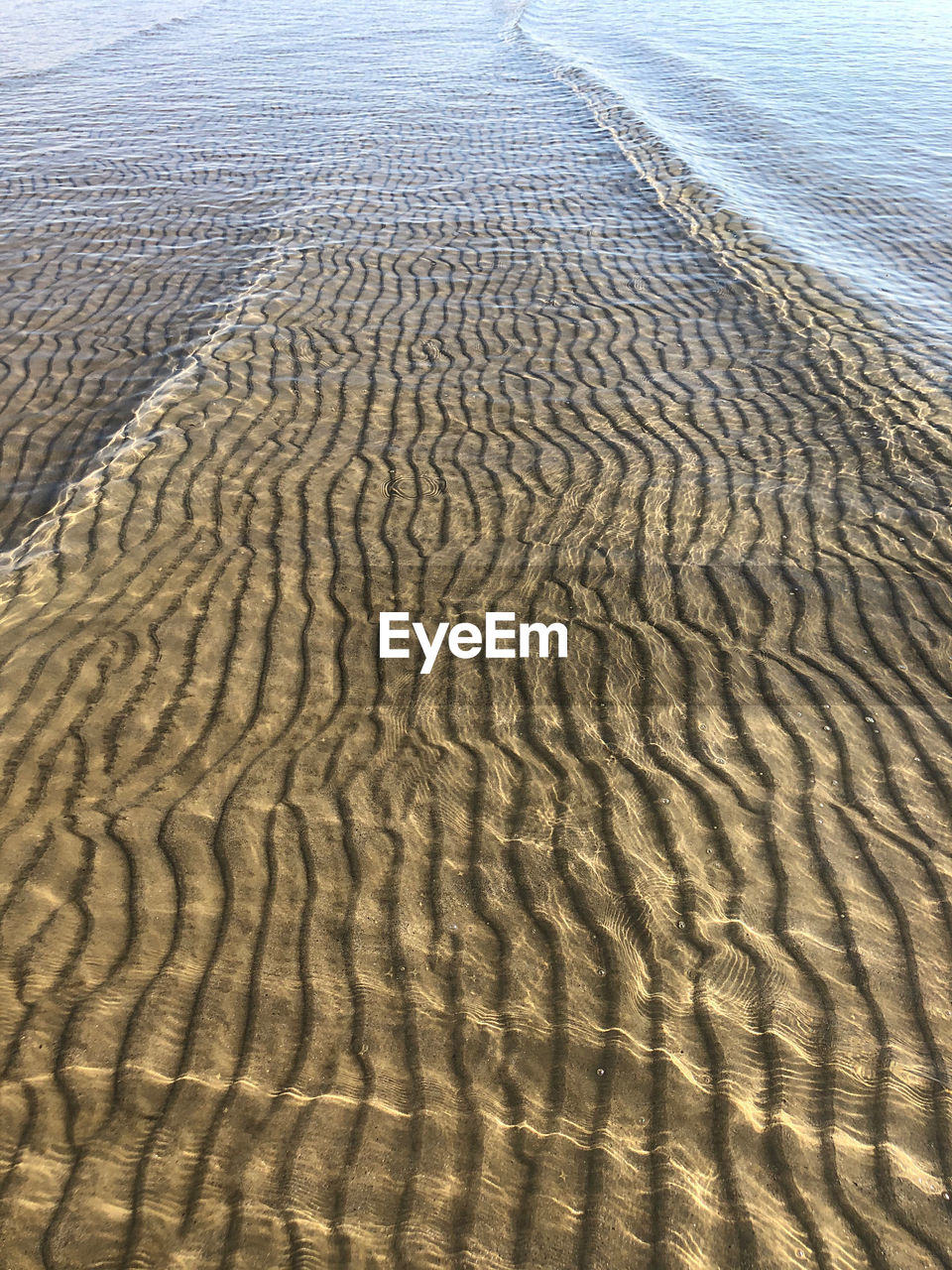 High angle view of sand dunes at beach