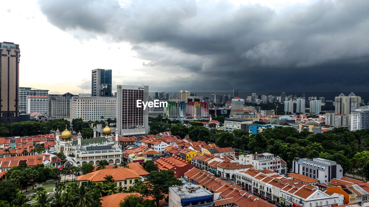 High angle view of buildings in city against sky