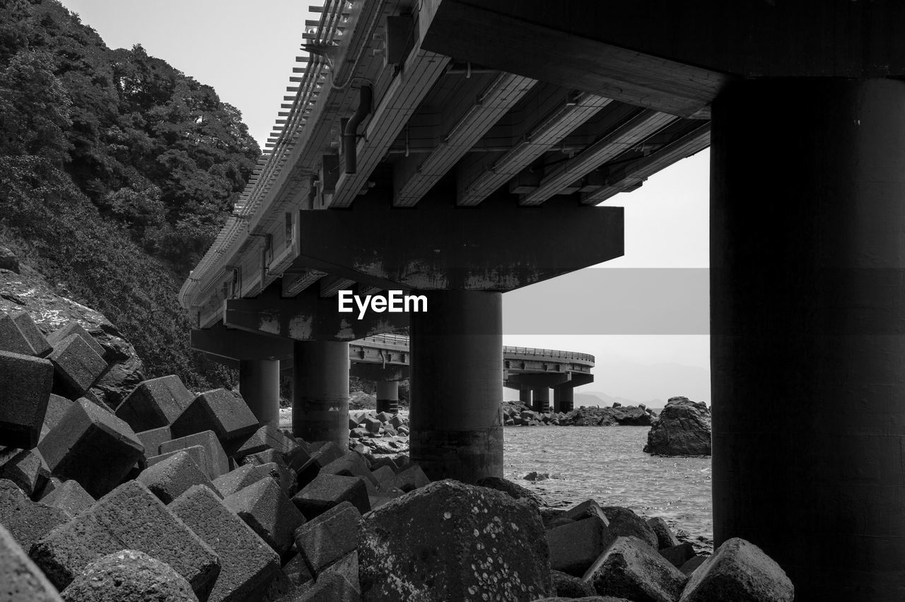 Below view of bridge over groyne in sea