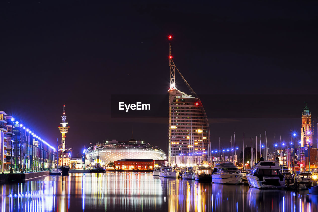 Illuminated buildings in city at night