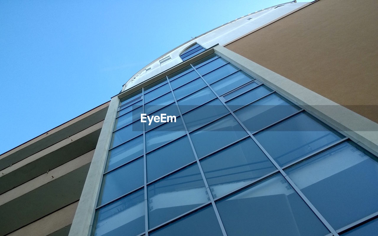 Low angle view of modern building against sky