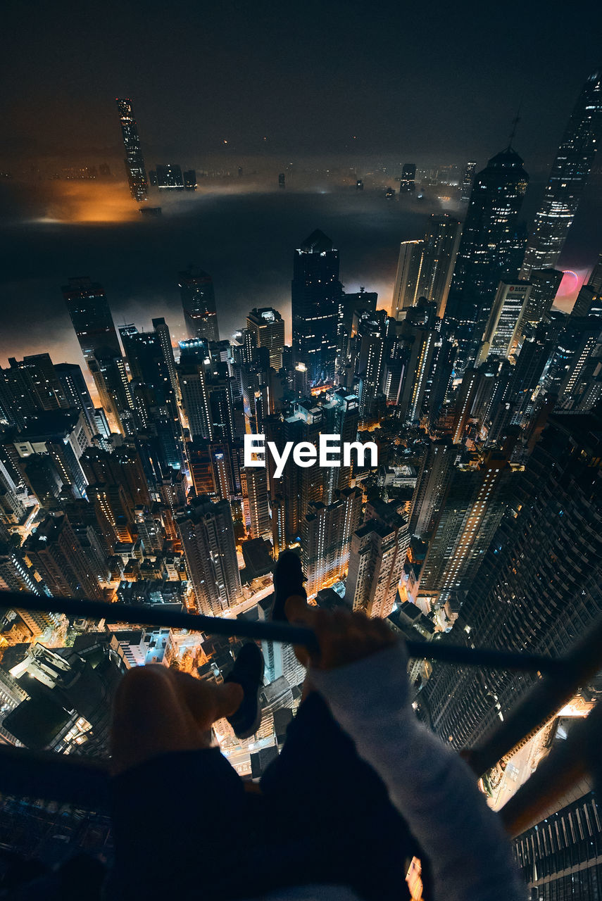 high angle view of illuminated buildings in city at night