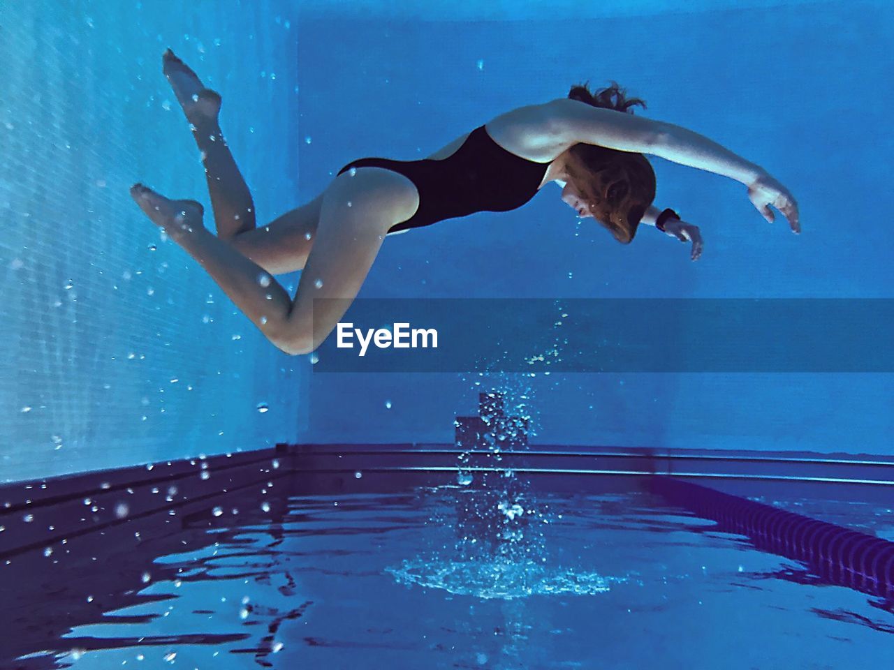 Young woman in swimming pool