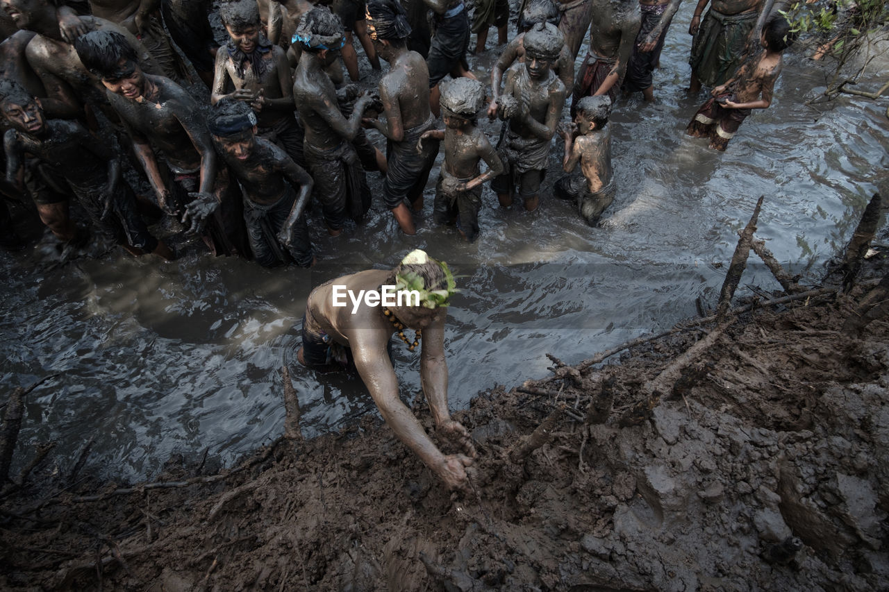 High angle view of people in muddy river