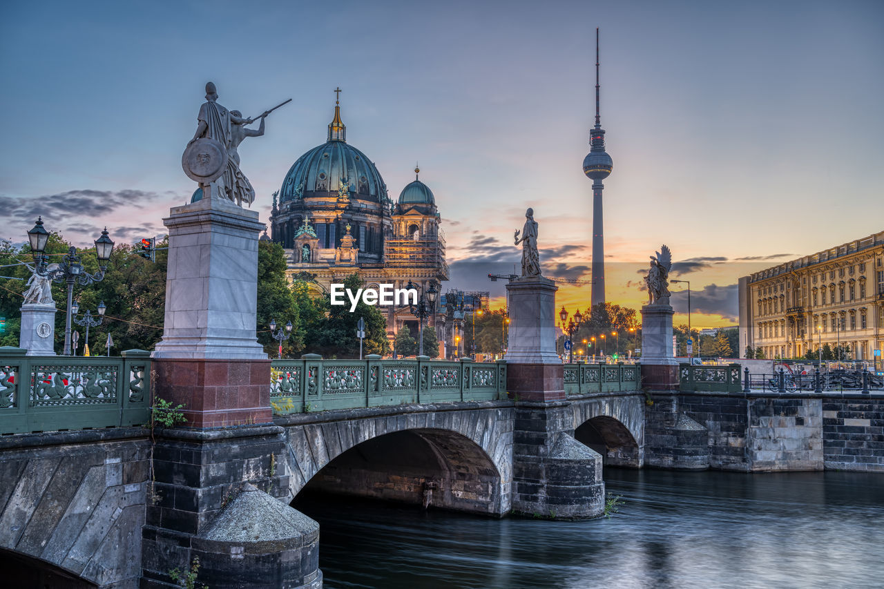 The cathedral, the tv tower and the schlossbruecke in berlin at dawn