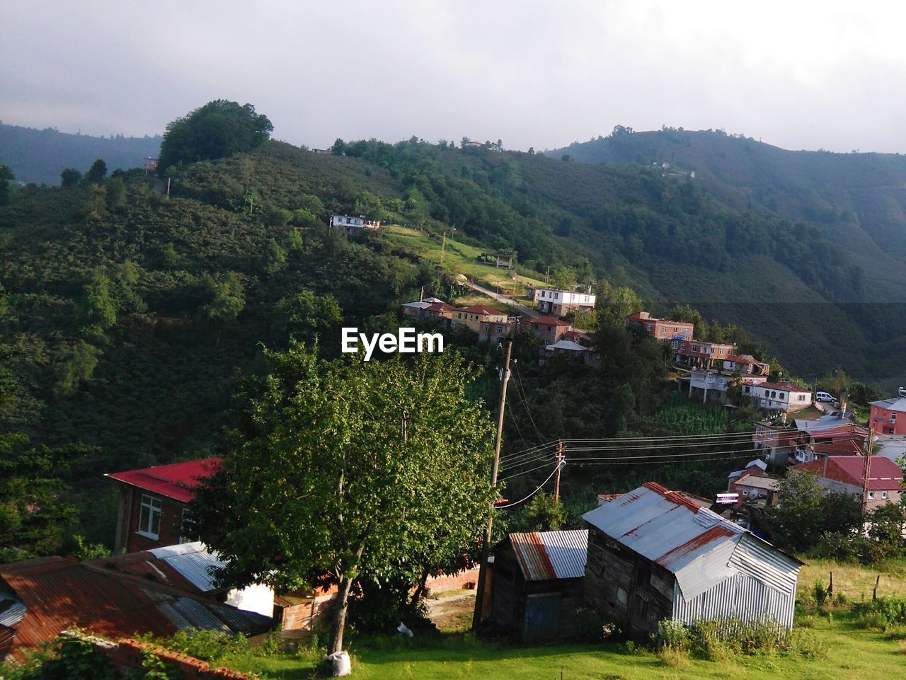 High angle view of houses and trees against sky