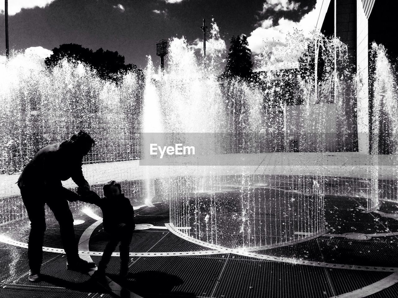 WOMAN STANDING IN WATER