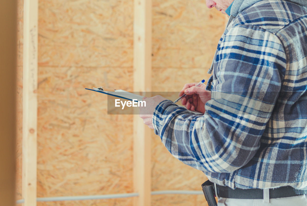 Man working on wall