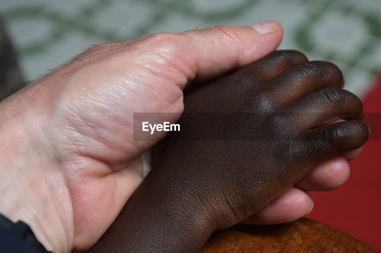 Close-up of people holding hands