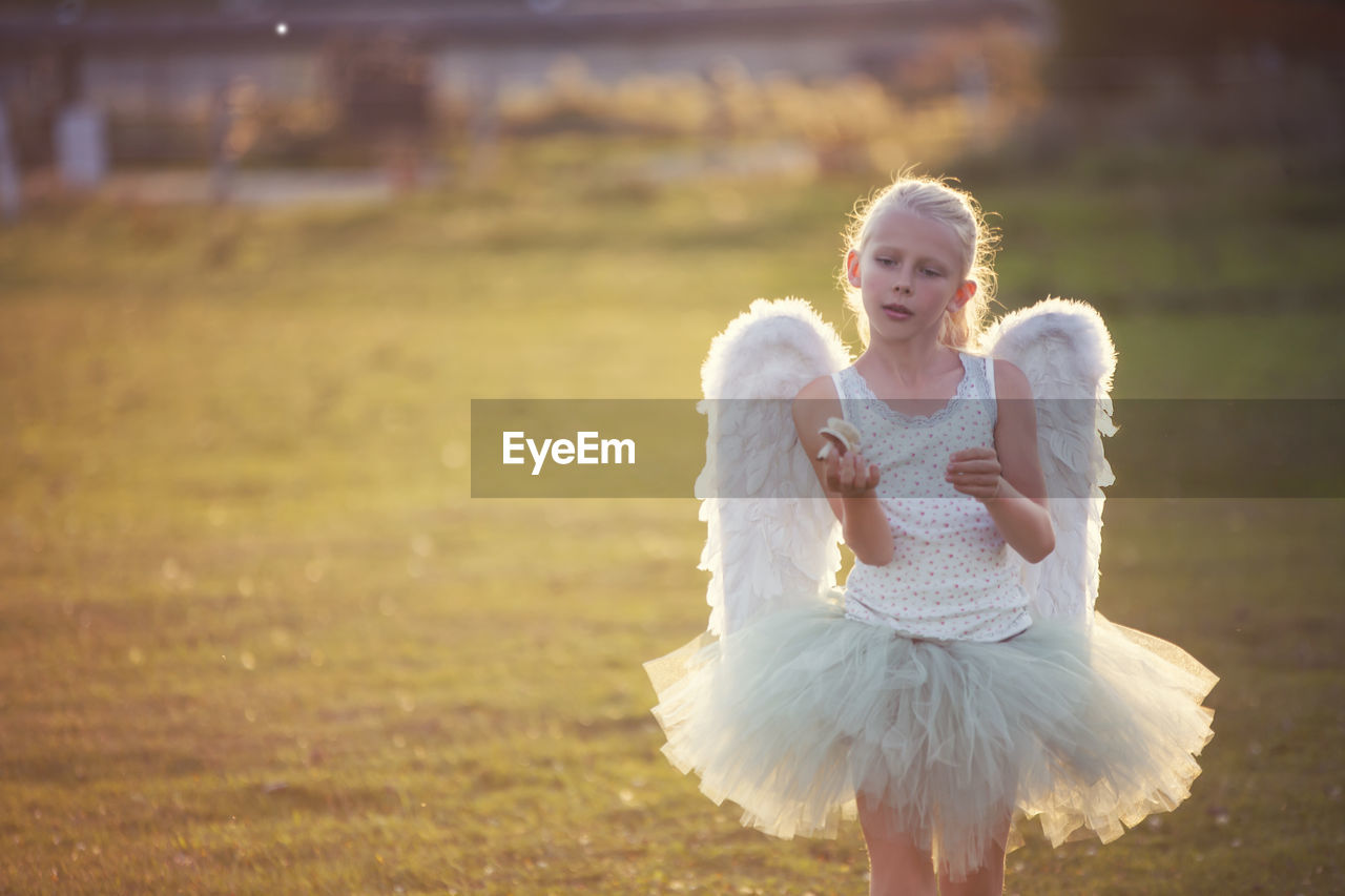 Portrait of girl wearing angel costume