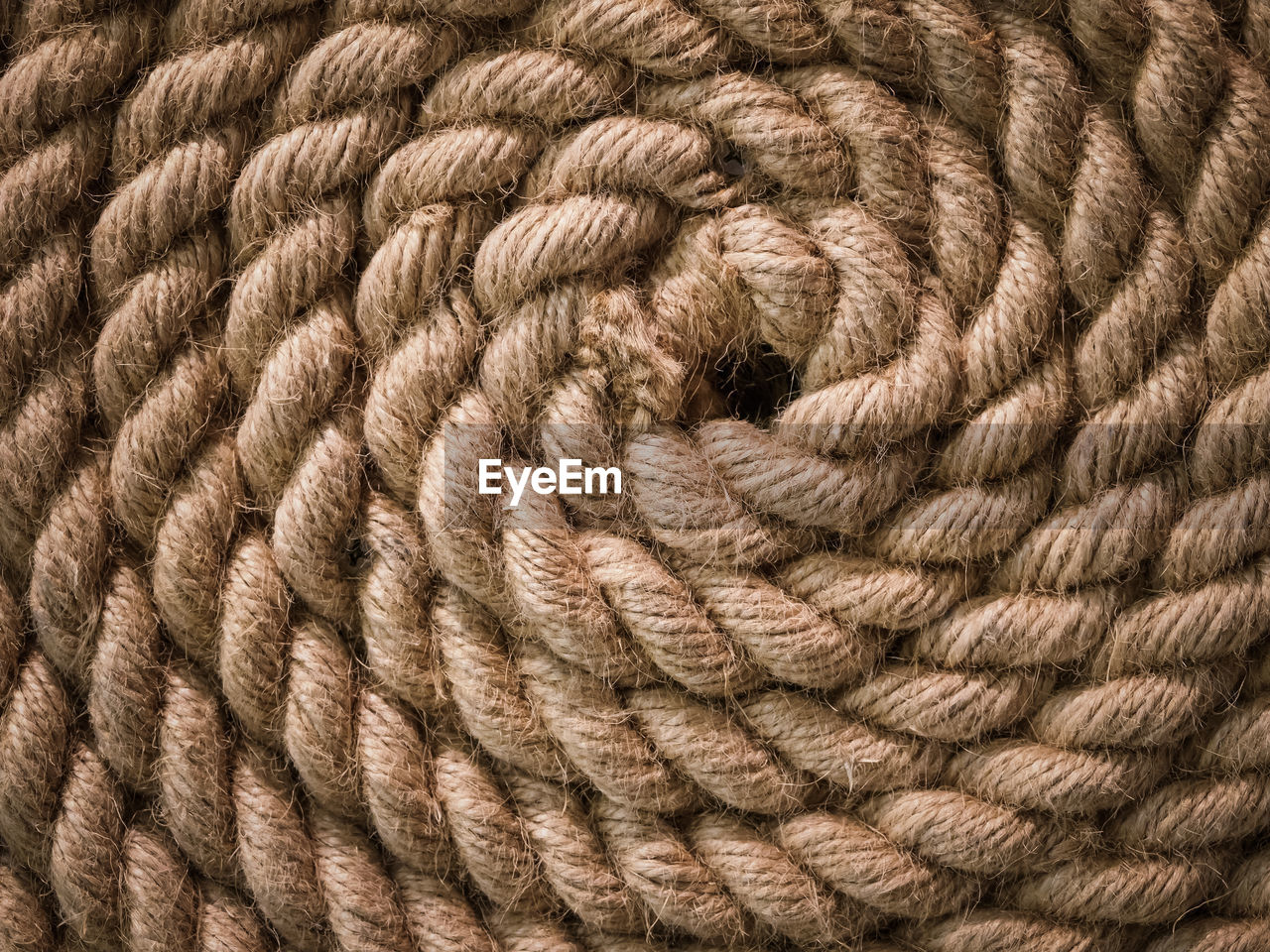 Rolled up nautical rope, flat lay and close up view