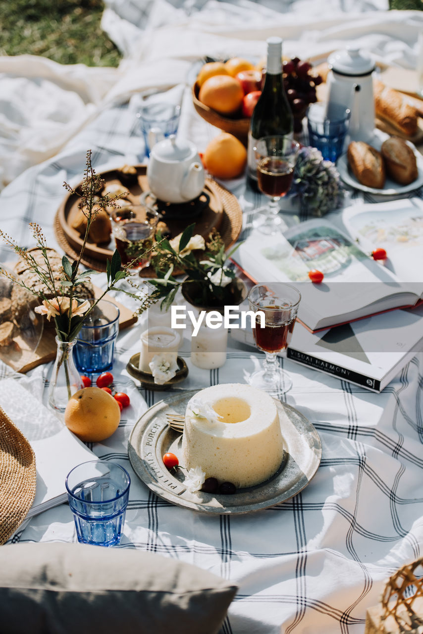 High angle view of food with decorations and books on table