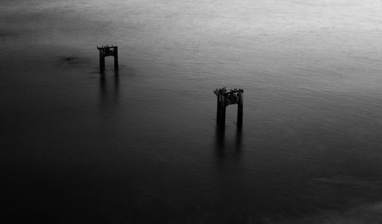 High angle view of damaged pier in sea