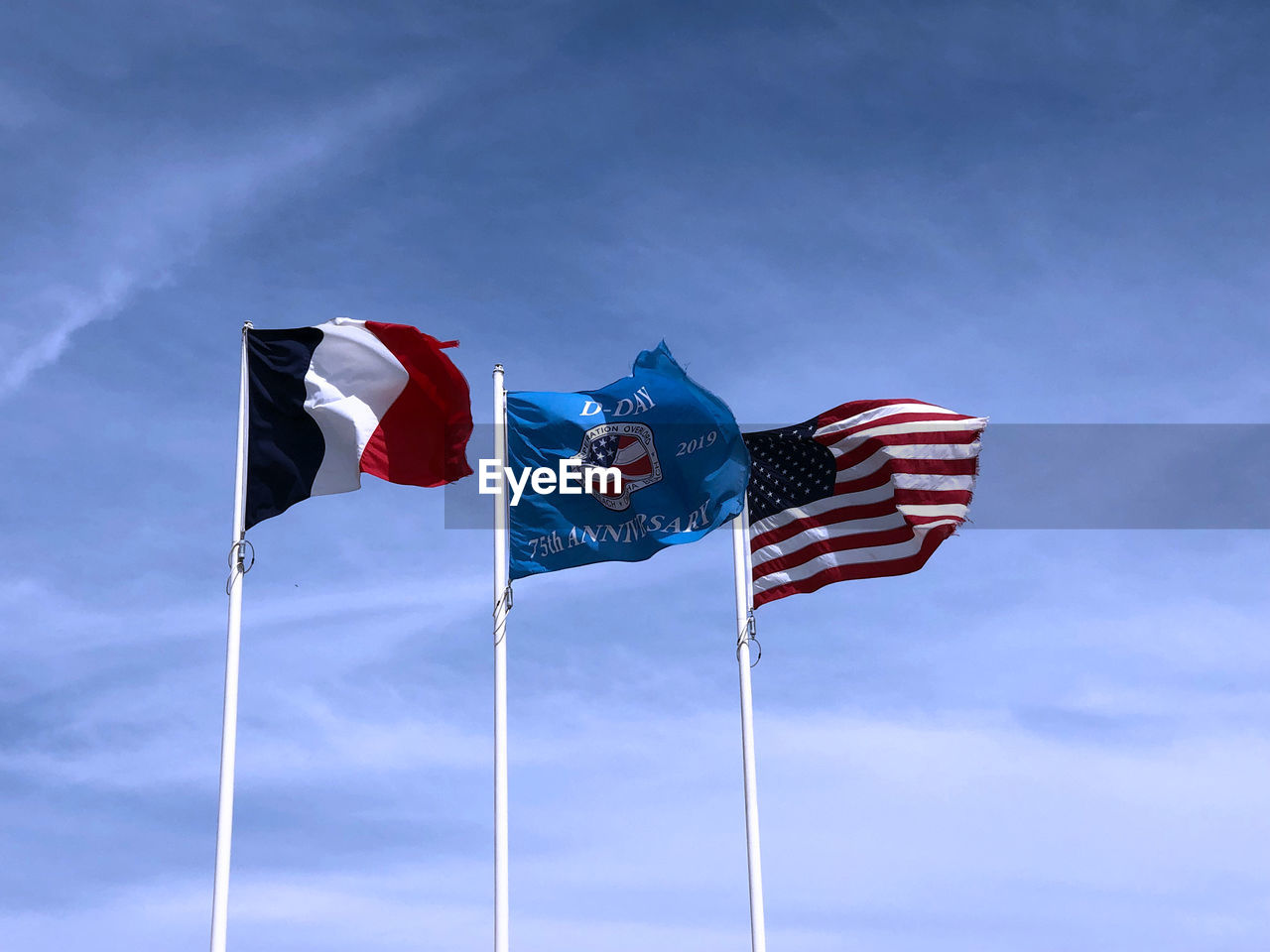 LOW ANGLE VIEW OF FLAG FLAGS AGAINST SKY