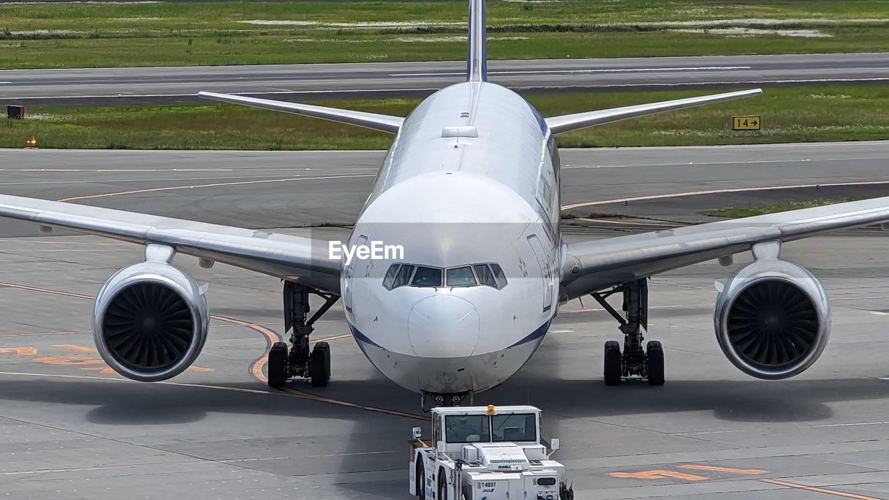 low angle view of airplane on airport runway