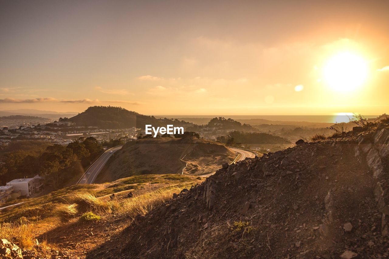 Scenic view of landscape against sky during sunset