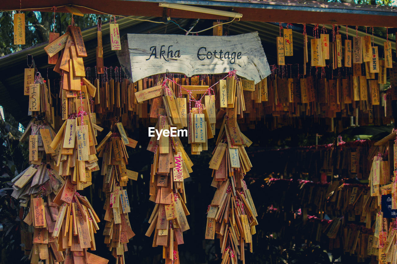 Panoramic view of various hanging for sale at market