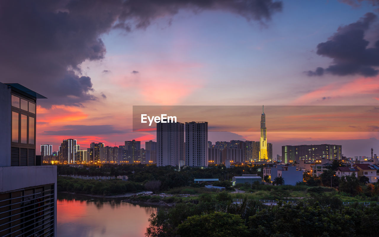 BUILDINGS AGAINST SKY DURING SUNSET