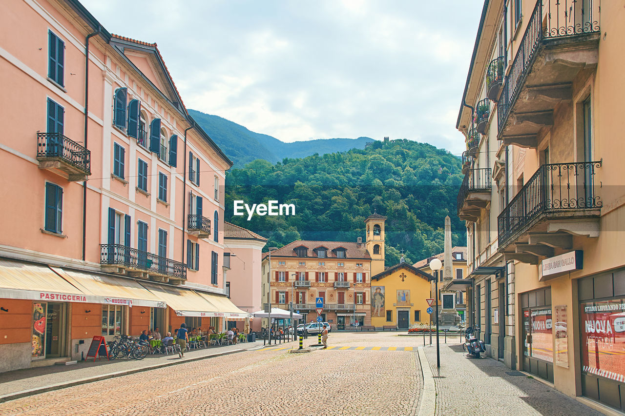 STREET AMIDST BUILDINGS IN CITY