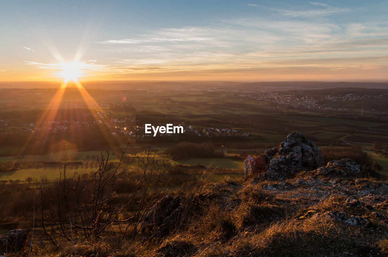 Aerial view of landscape against sky during sunset