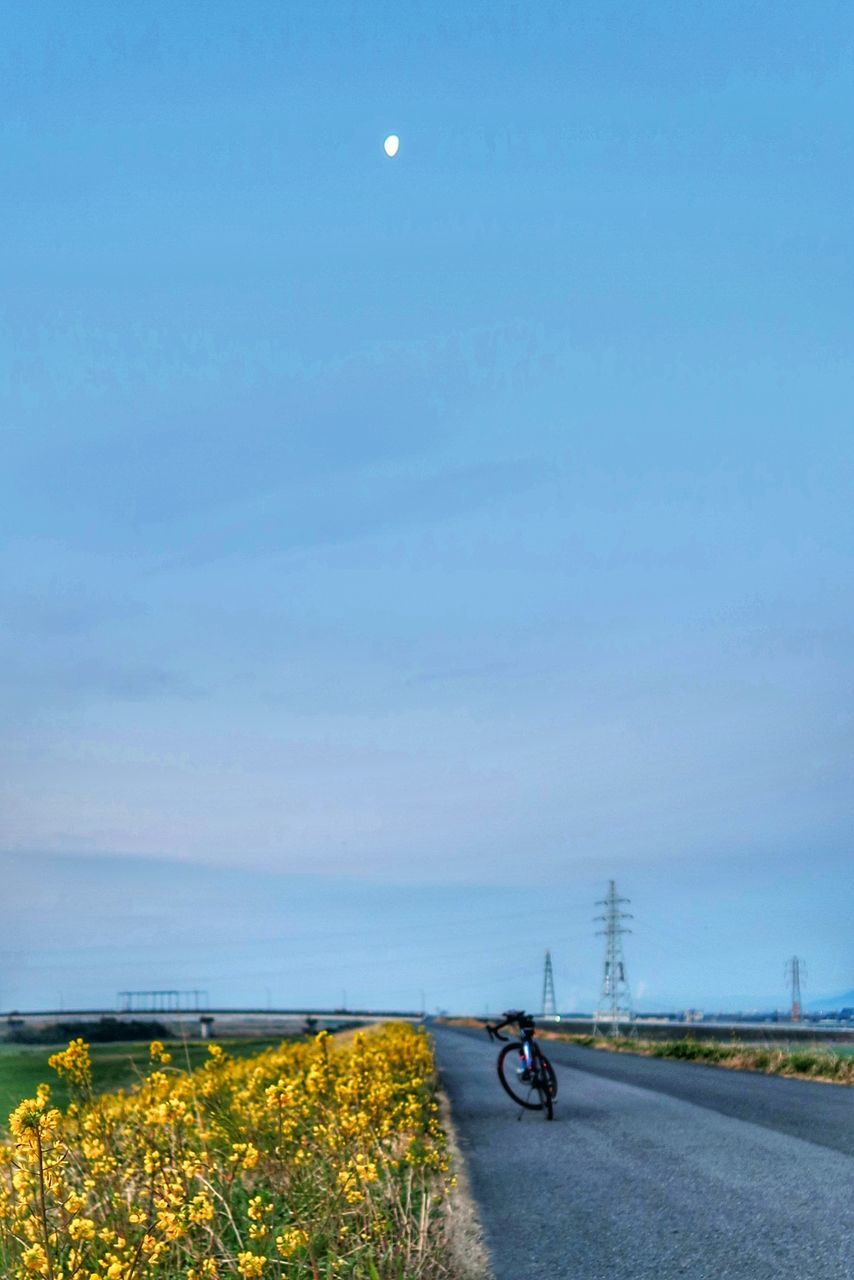 BICYCLE ON SEA SHORE AGAINST SKY