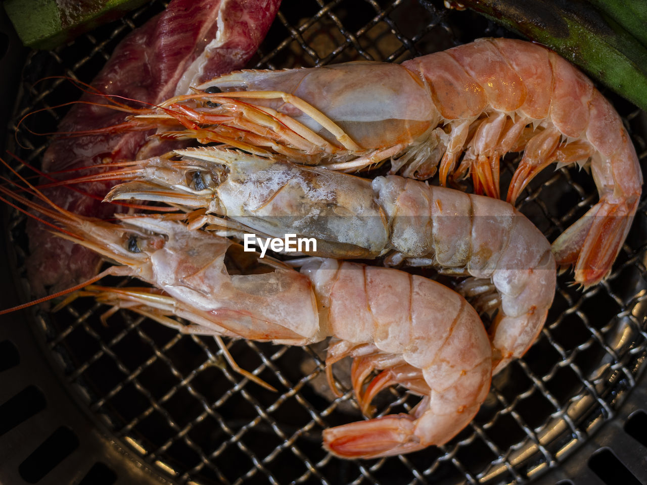 CLOSE-UP OF FISH ON BARBECUE