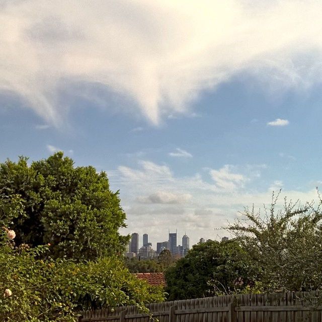 BUILDINGS IN CITY AGAINST SKY