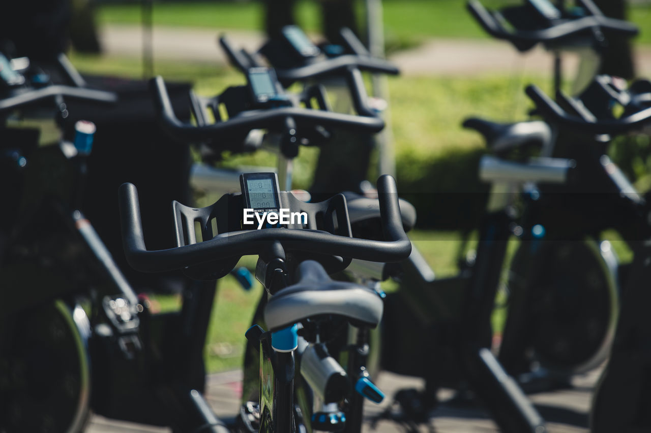 Close-up of exercise bikes in gym