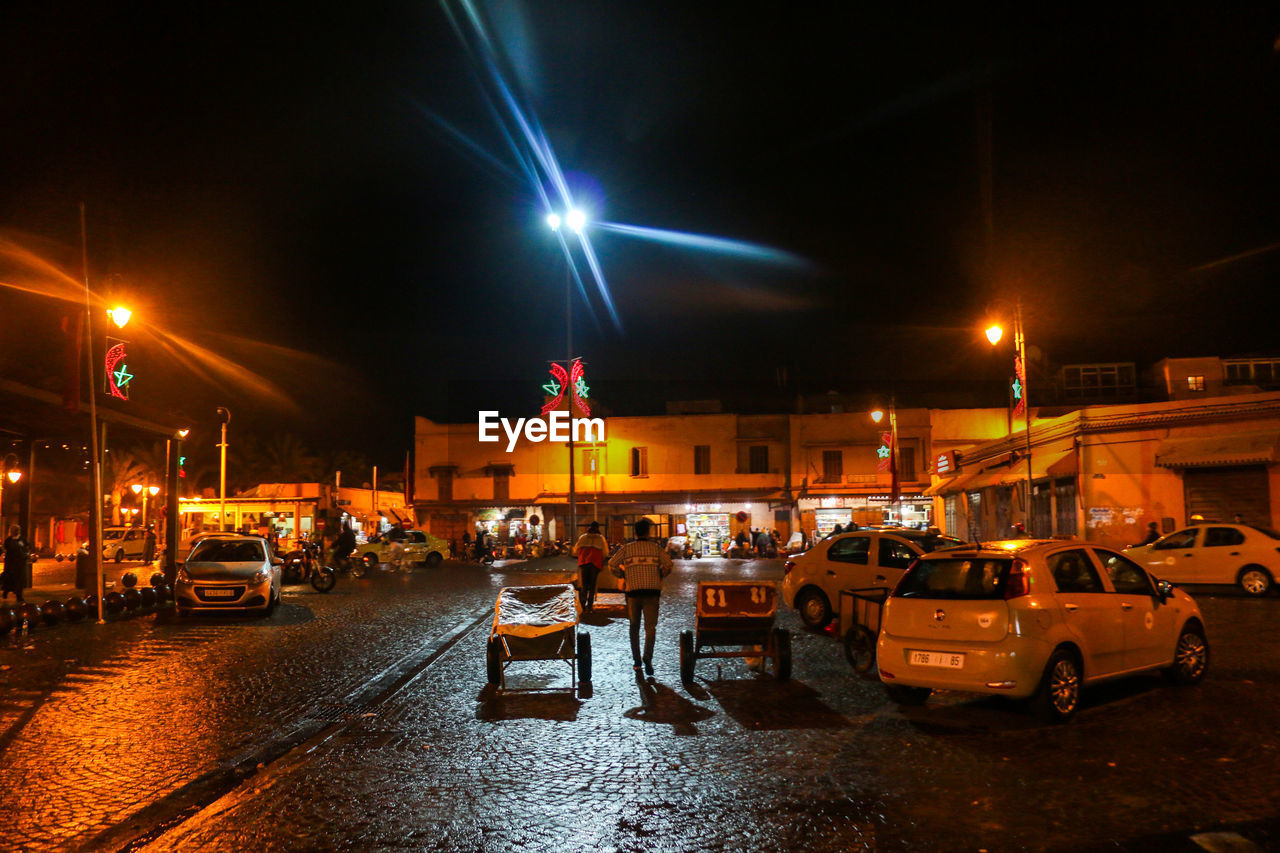 CARS ON STREET AT NIGHT