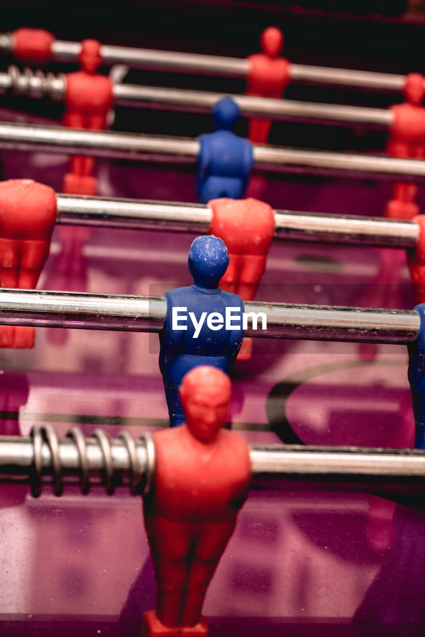 FULL FRAME SHOT OF FIGURINE ON SHELF