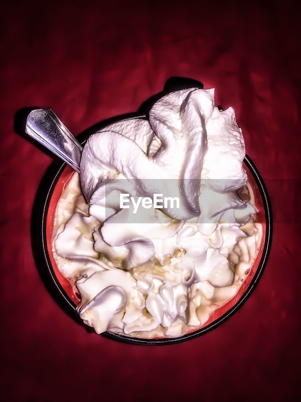 Close-up of coffee with whipped cream in glass