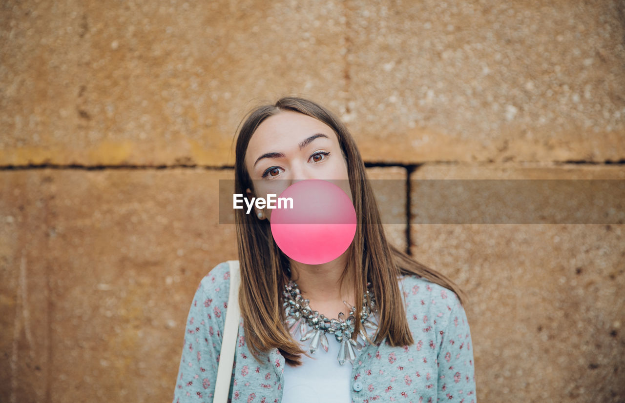 PORTRAIT OF A BEAUTIFUL YOUNG WOMAN IN BUBBLE