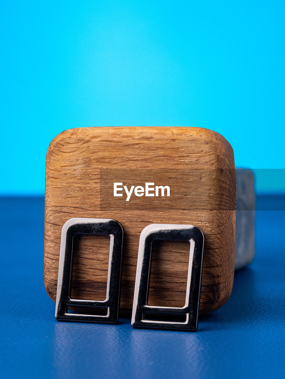 high angle view of wooden figurine against blue background
