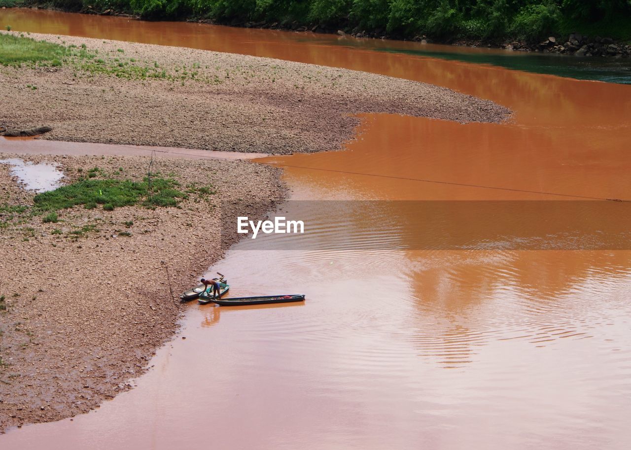 Aerial view of fishing boat on river