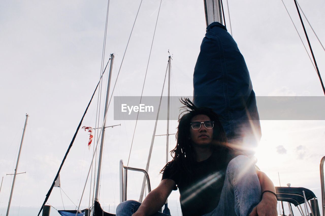 Young man with dreadlock on boat