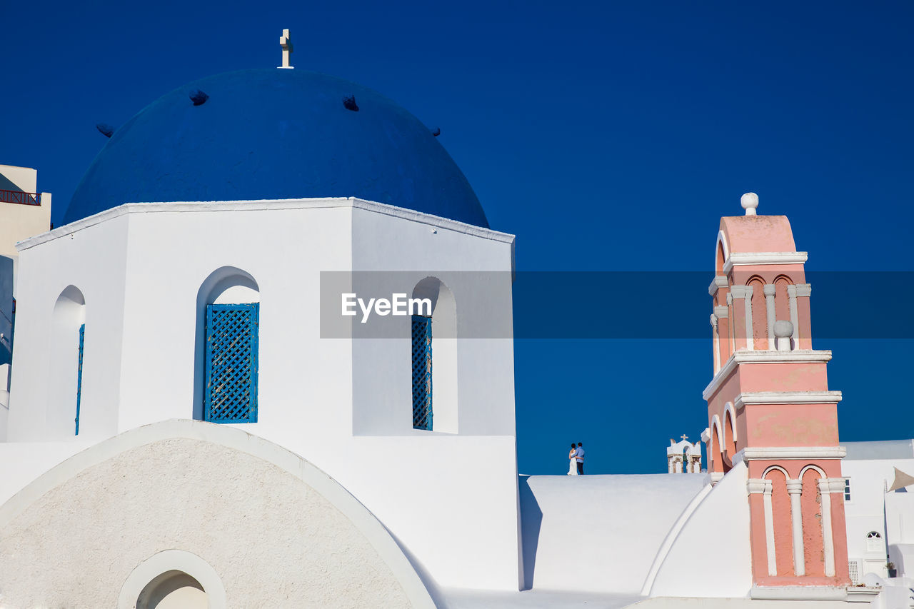 Traditional architecture of the churches of the oia city in santorini island