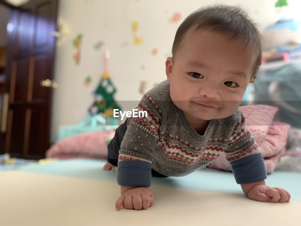 PORTRAIT OF CUTE BABY GIRL AT HOME