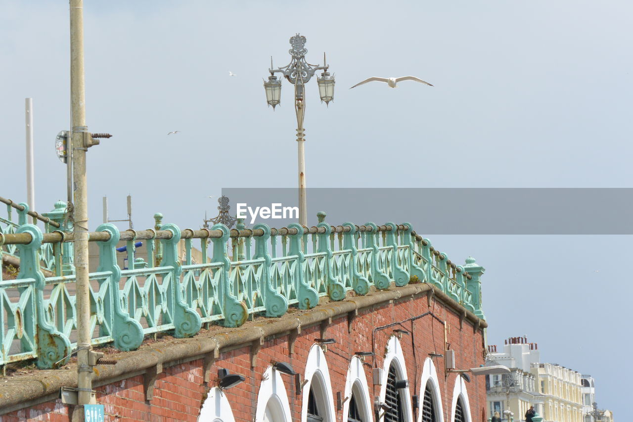 architecture, sky, built structure, landmark, building exterior, nature, travel destinations, no people, day, street light, city, clear sky, travel, outdoors, tourism, building, history, the past, water, street, sunny, bird