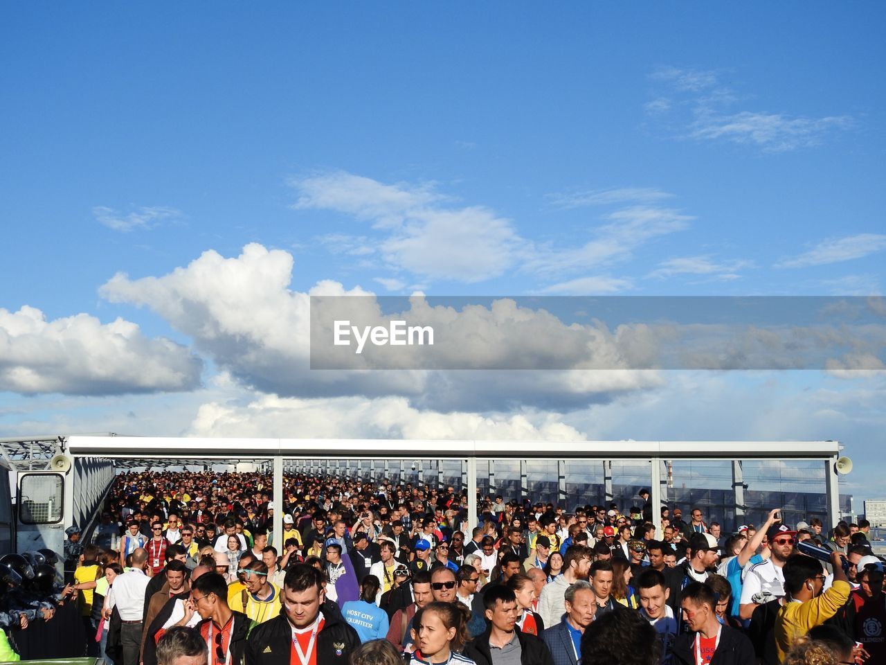 Group of people standing against sky