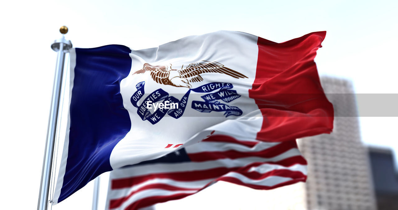 flag, patriotism, wind, environment, sky, red, low angle view, nature, no people, emotion, symbol, blue, white, outdoors, pride