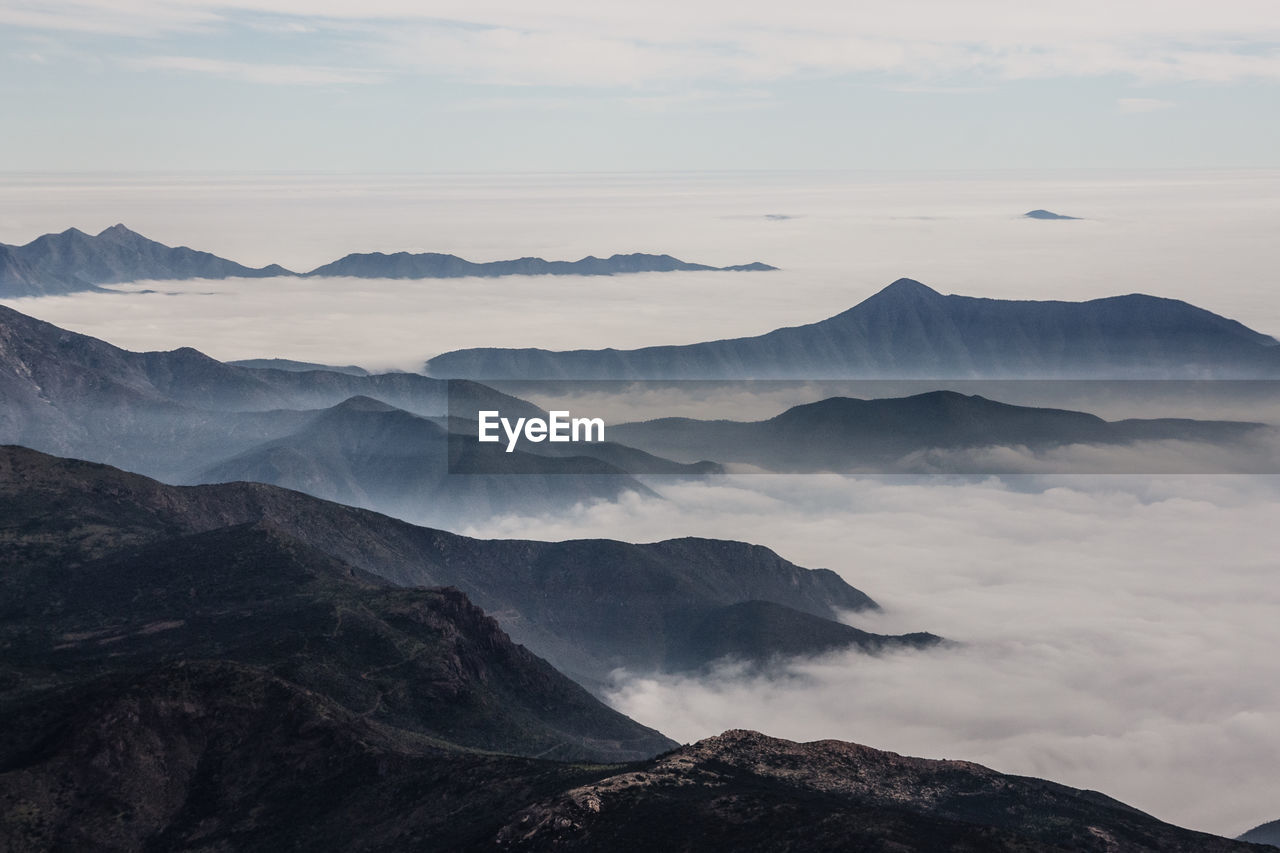 Aerial view of mountains in foggy weather