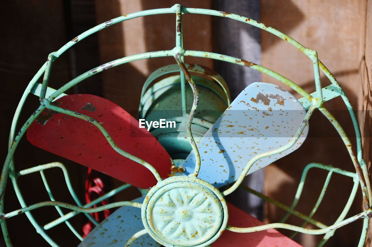 HIGH ANGLE VIEW OF PLANT BY METAL CONTAINER