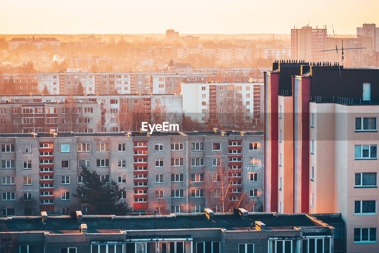 High angle view of buildings against sky during sunset