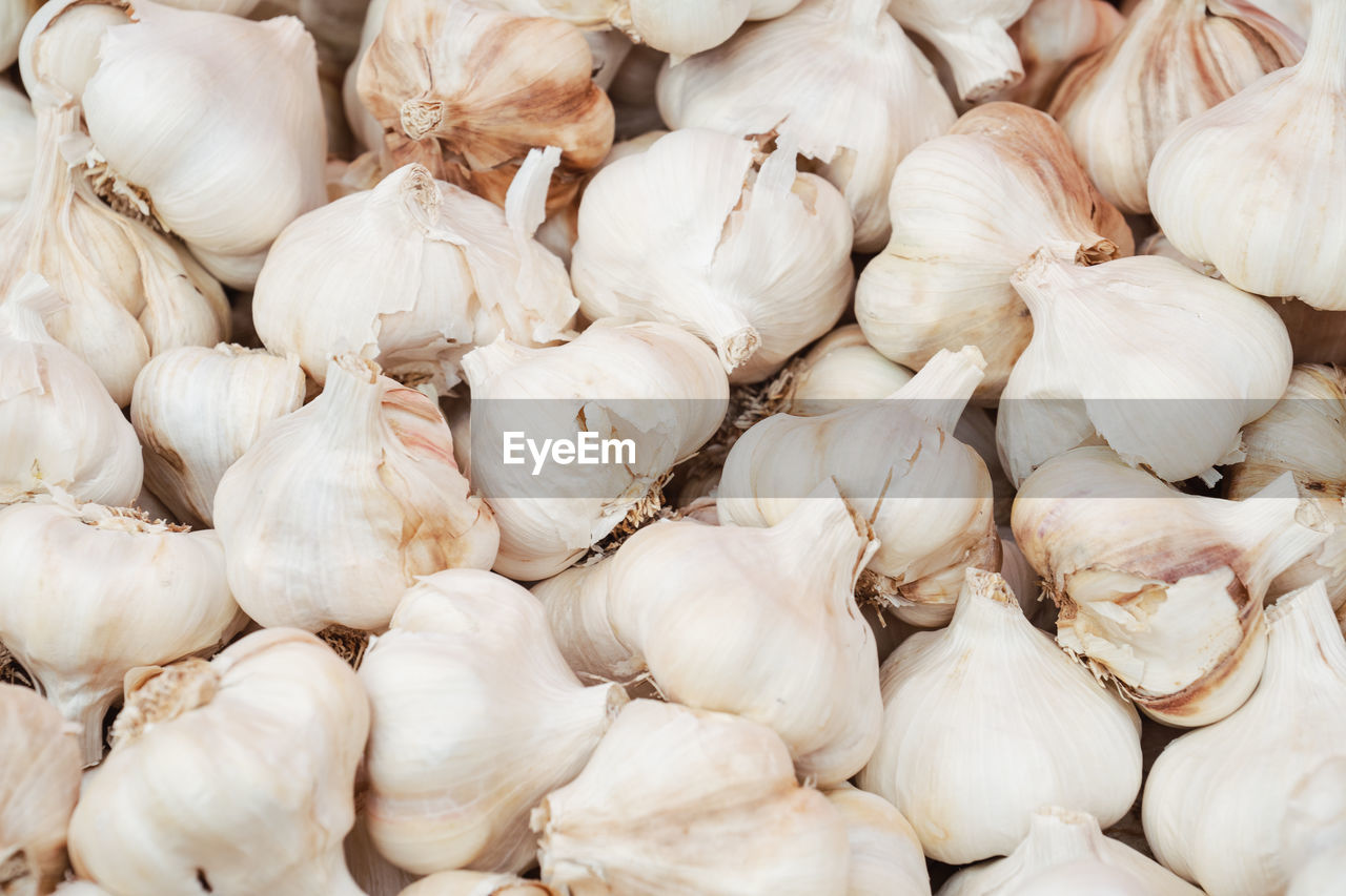 Full frame shot of garlic bulbs for sale at market