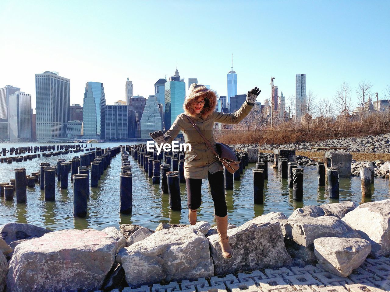 Woman in front of cityscape