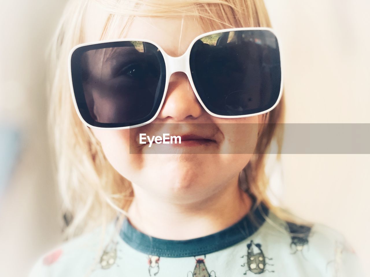 Close-up portrait of boy wearing sunglasses