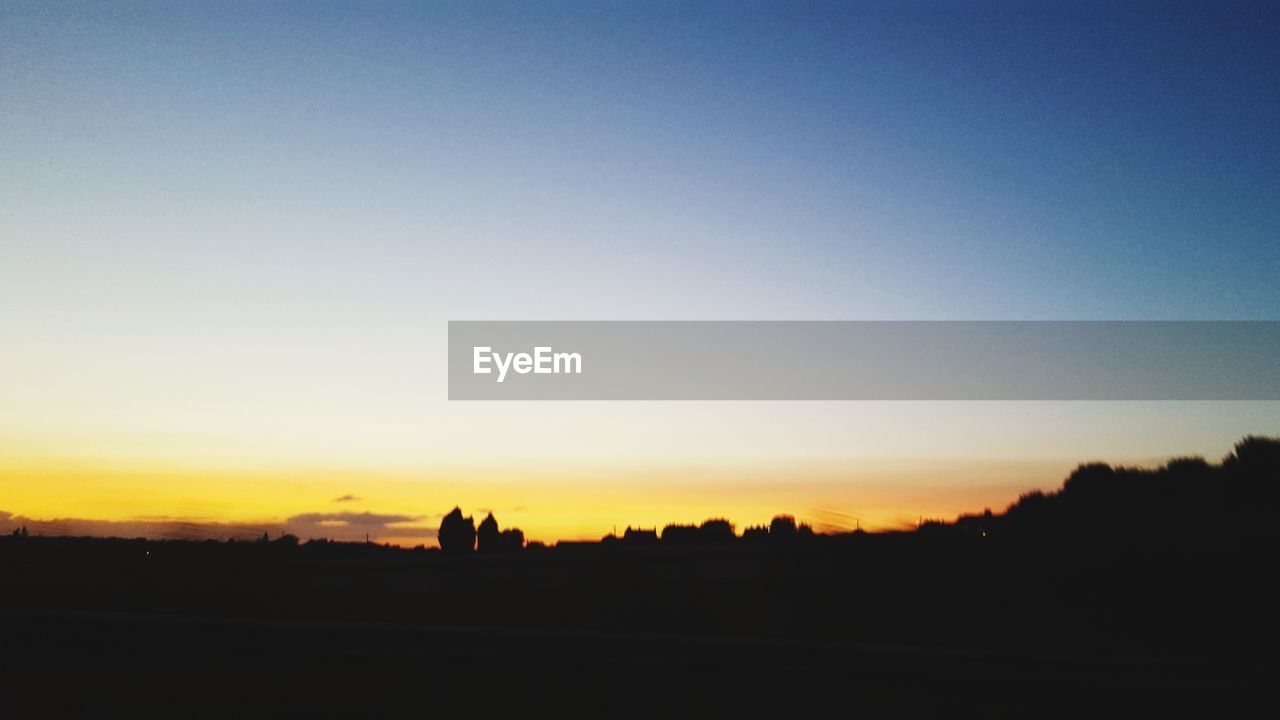 SILHOUETTE LANDSCAPE AGAINST CLEAR SKY