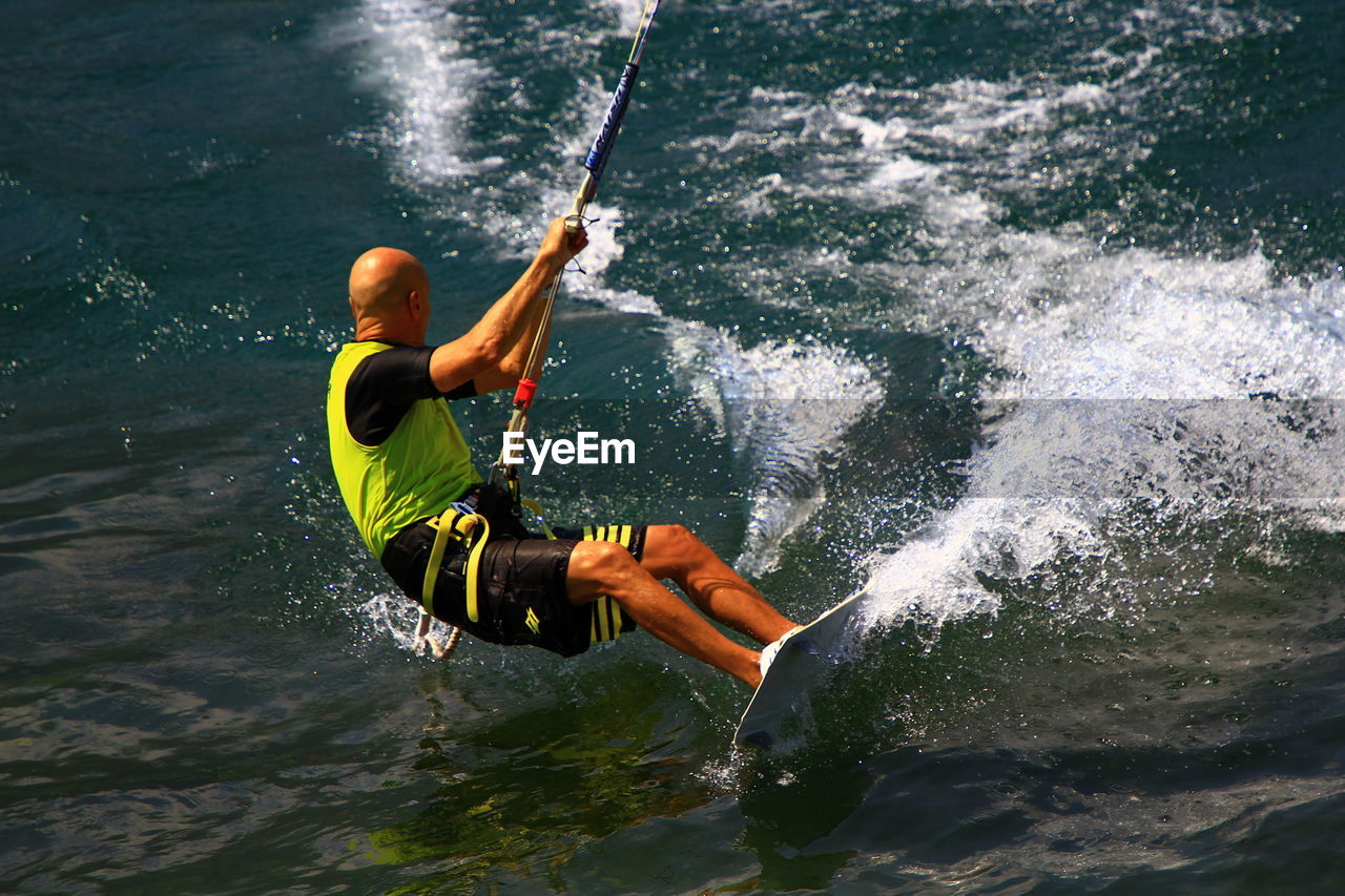 MAN SPLASHING WATER