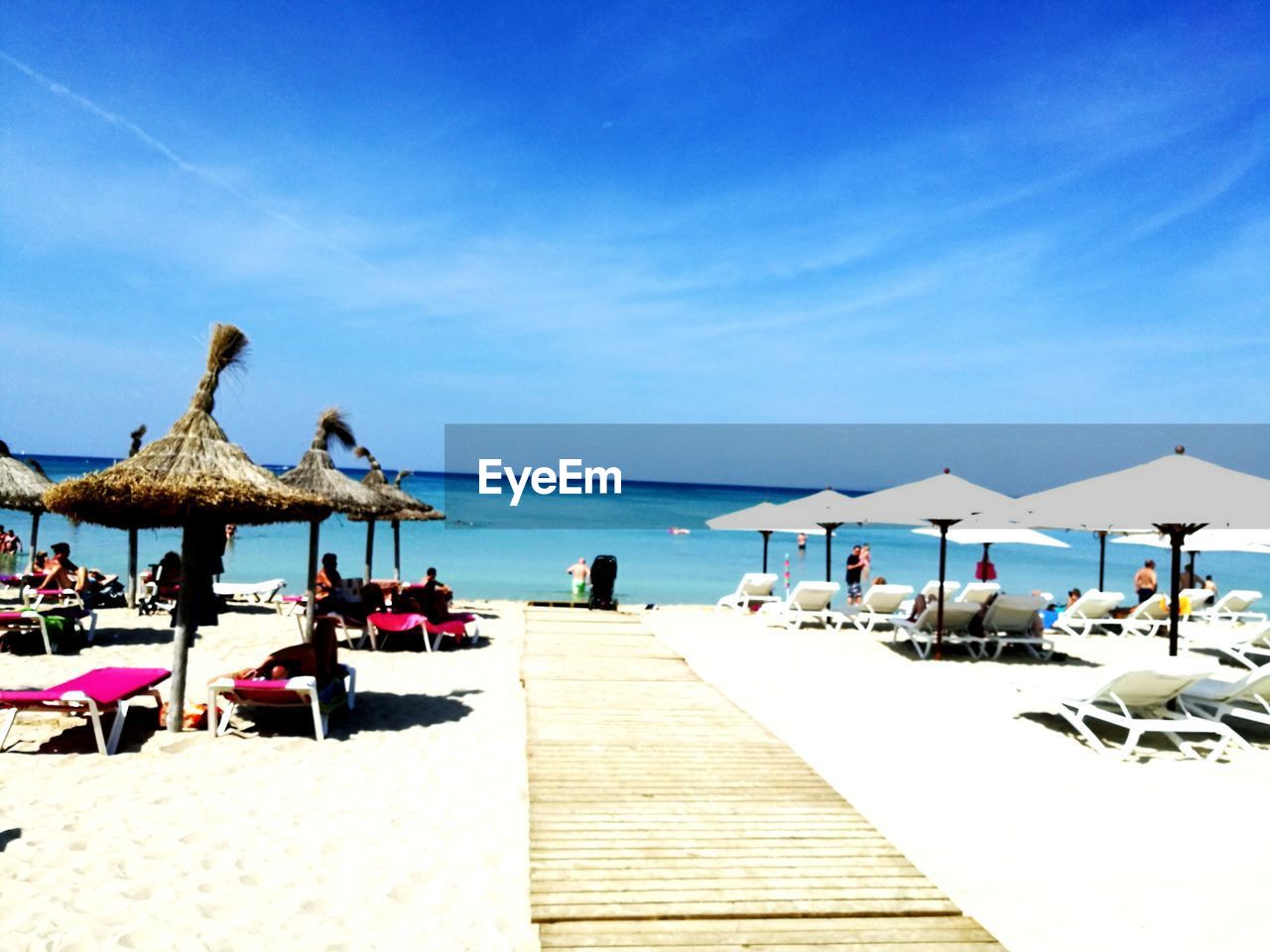 PANORAMIC VIEW OF PEOPLE ON BEACH